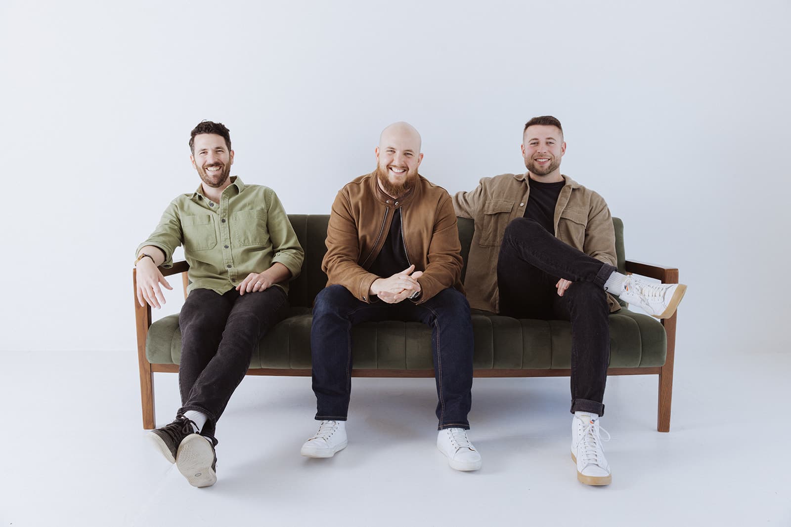 Zach, Corey and Nick, the three founders of Main Street, sitting on a couch